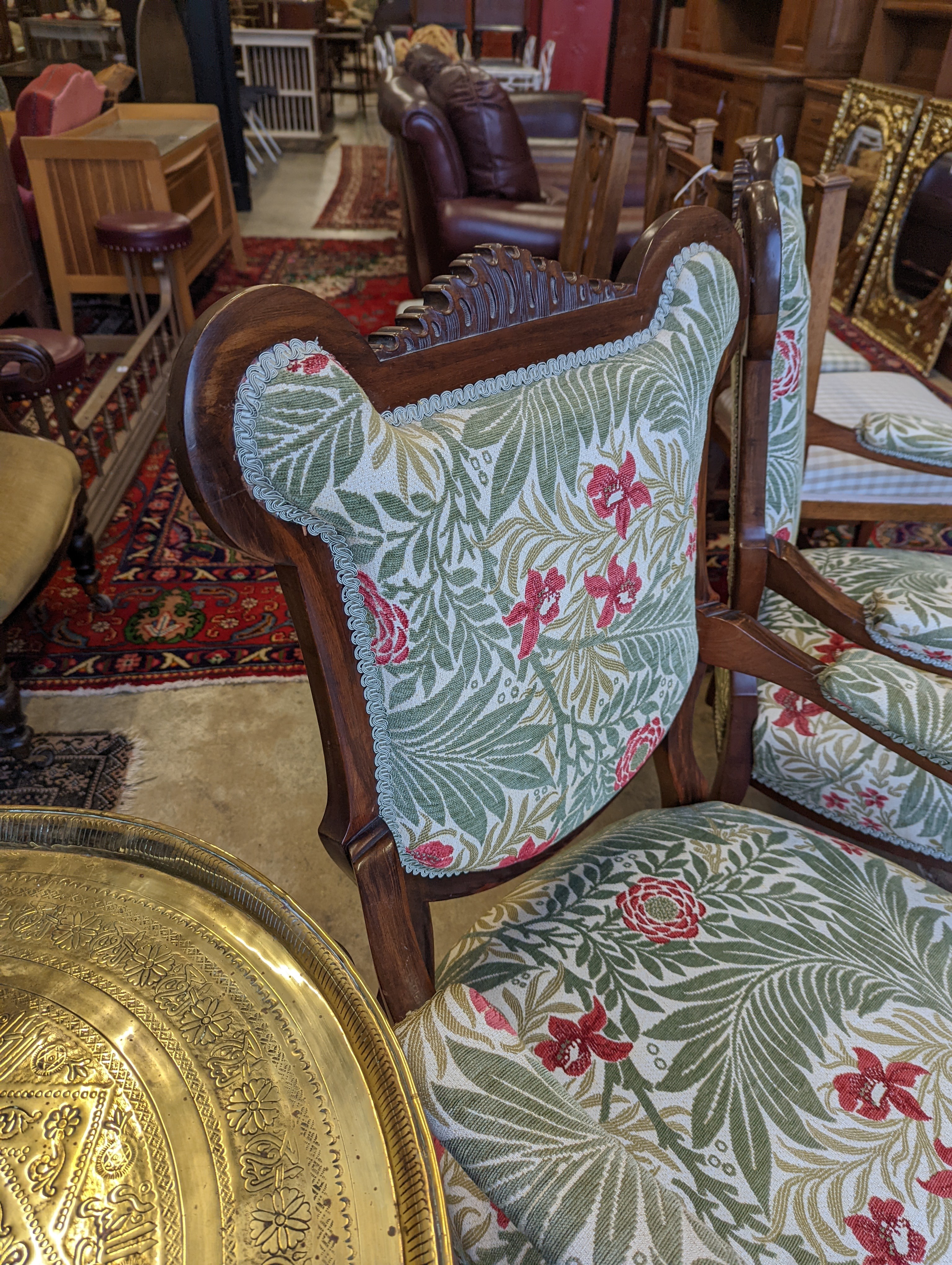 A pair of late Victorian mahogany upholstered drawing room chairs